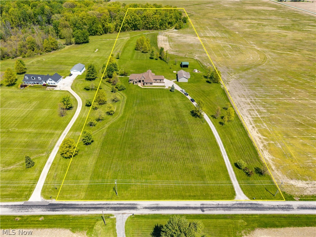 51488 Peck Wadsworth Road Wellington, OH 44090 - Photo 2 of 50 Expansive rural property featuring a primary residence with an attached garage, a detached garage, and a separate outbuilding