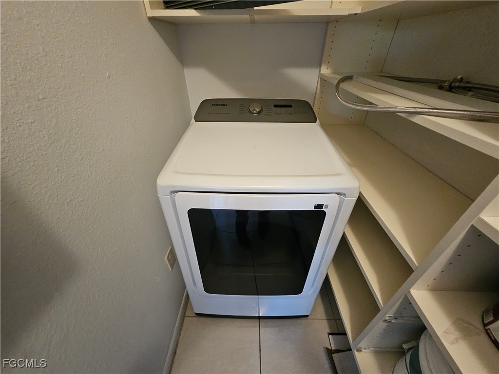 1830 Brantley Road, Unit F204 Fort Myers, FL 33907 - Photo 11 of 23 a utility room with dryer and washer