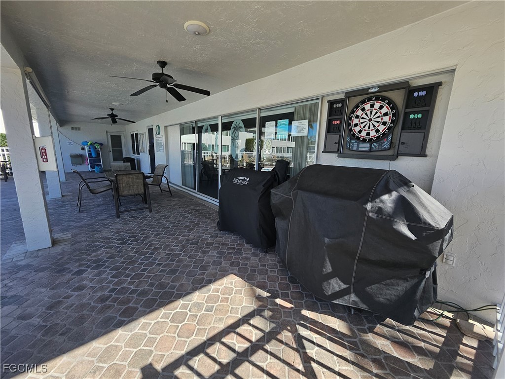 1830 Brantley Road, Unit F204 Fort Myers, FL 33907 - Photo 14 of 23 a living room with furniture and a rug