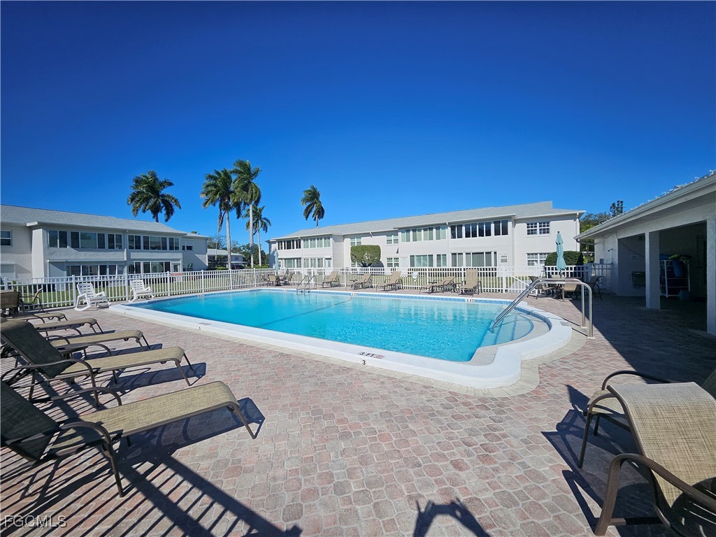 1830 Brantley Road, Unit F204 Fort Myers, FL 33907 - Photo 15 of 23 a view of a swimming pool with seating space