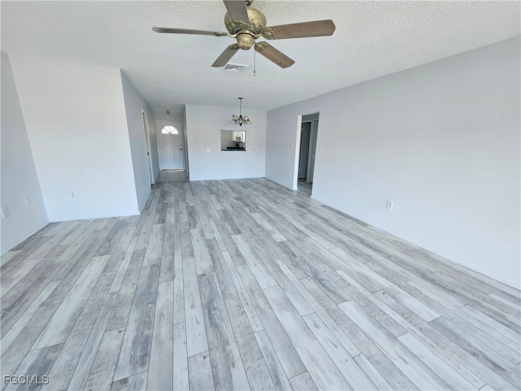 1830 Brantley Road, Unit F204 Fort Myers, FL 33907 - Photo 5 of 23 a view of empty room with wooden floor