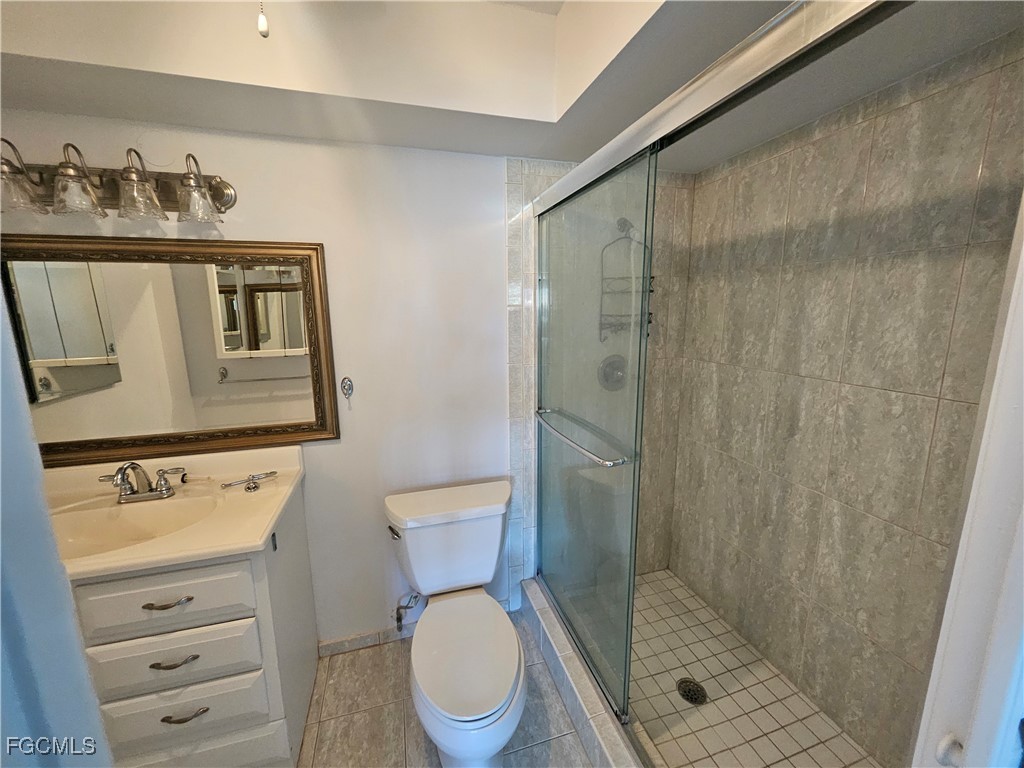 1830 Brantley Road, Unit F204 Fort Myers, FL 33907 - Photo 7 of 23 a bathroom with a toilet a sink and shower