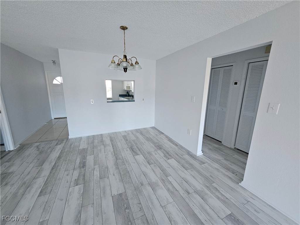 1830 Brantley Road, Unit F204 Fort Myers, FL 33907 - Photo 10 of 23 a view of a room with wooden floor a sink and a window