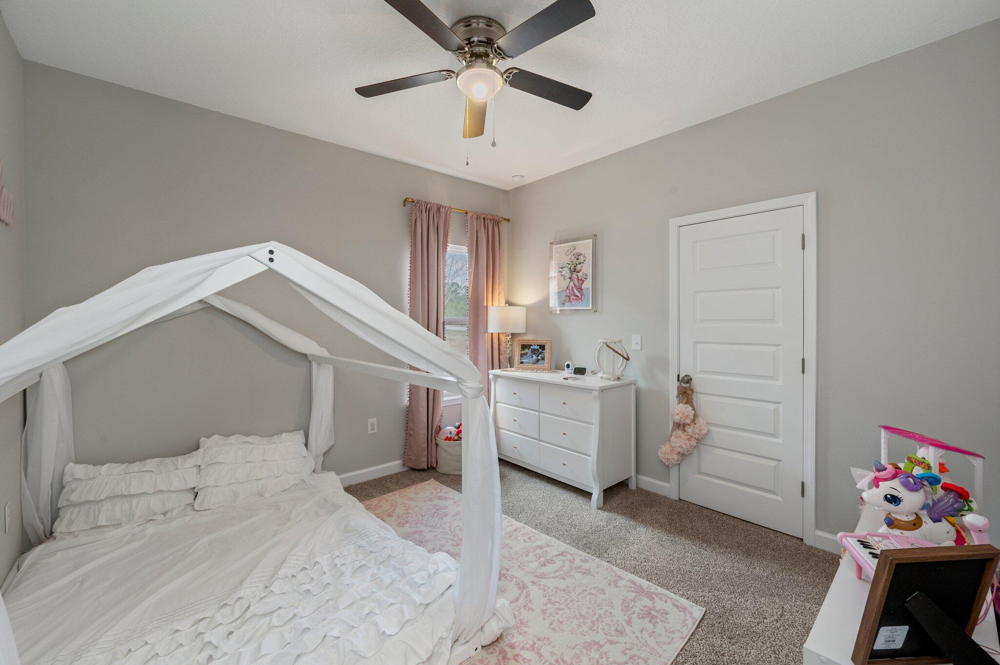5754 Wayne Rogers Road Crestview, FL 32539 - Photo 20 of 44 a room with a baby bed baby crib and a window