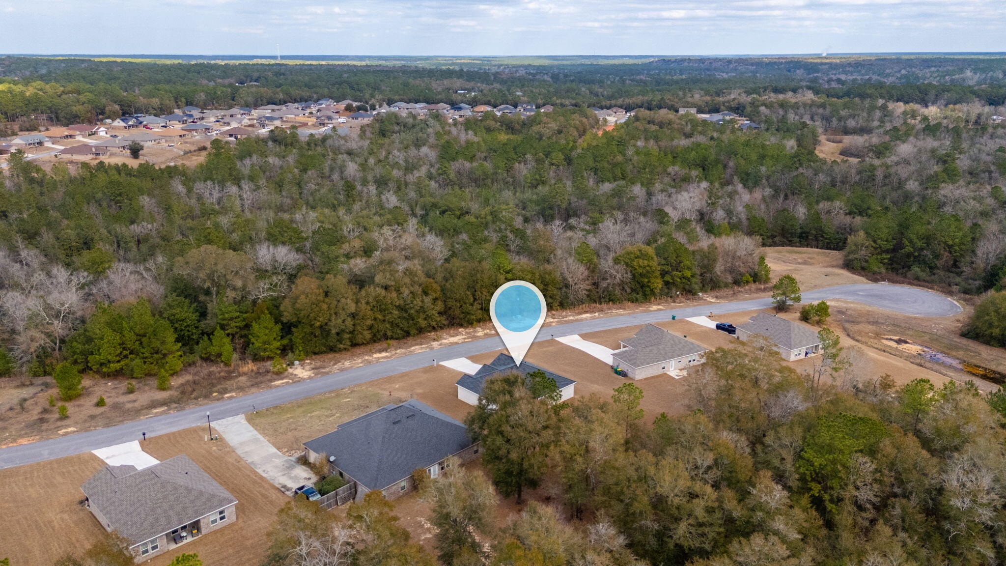 5754 Wayne Rogers Road Crestview, FL 32539 - Photo 33 of 44 a view of a lake with a yard