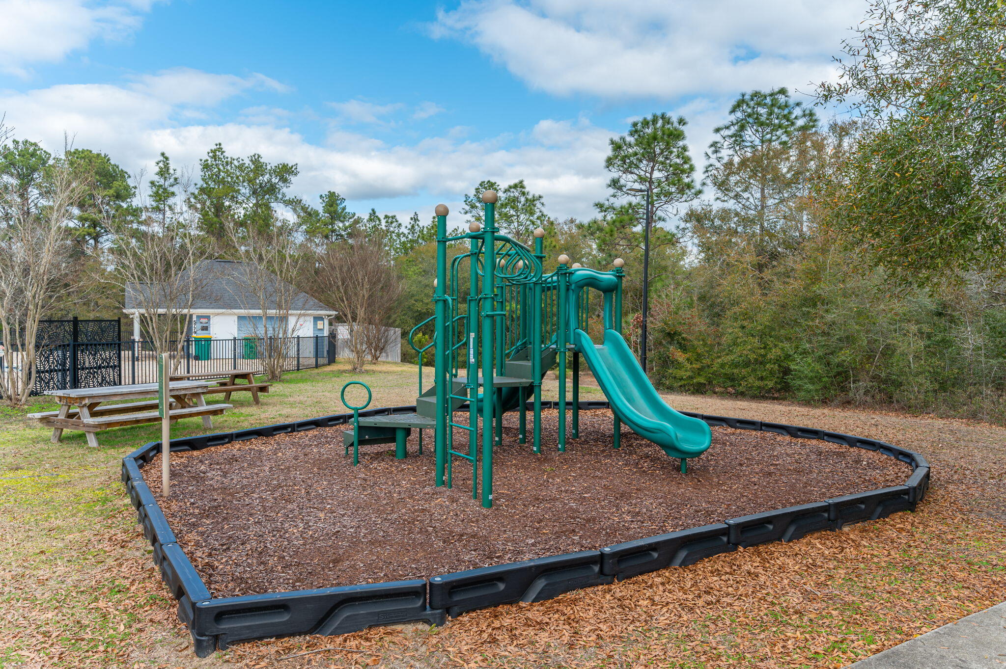 5754 Wayne Rogers Road Crestview, FL 32539 - Photo 37 of 44 a view of a park with large trees