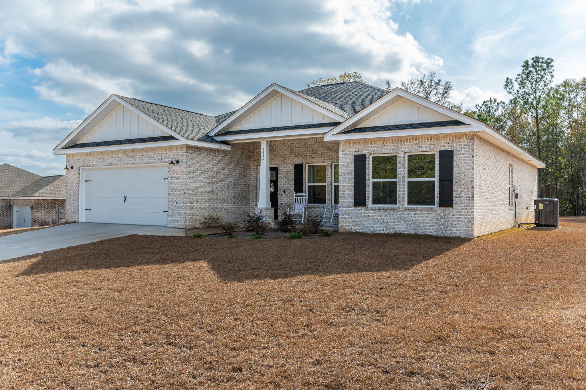 5754 Wayne Rogers Road Crestview, FL 32539 - Photo 41 of 44 a view of a white house with a yard