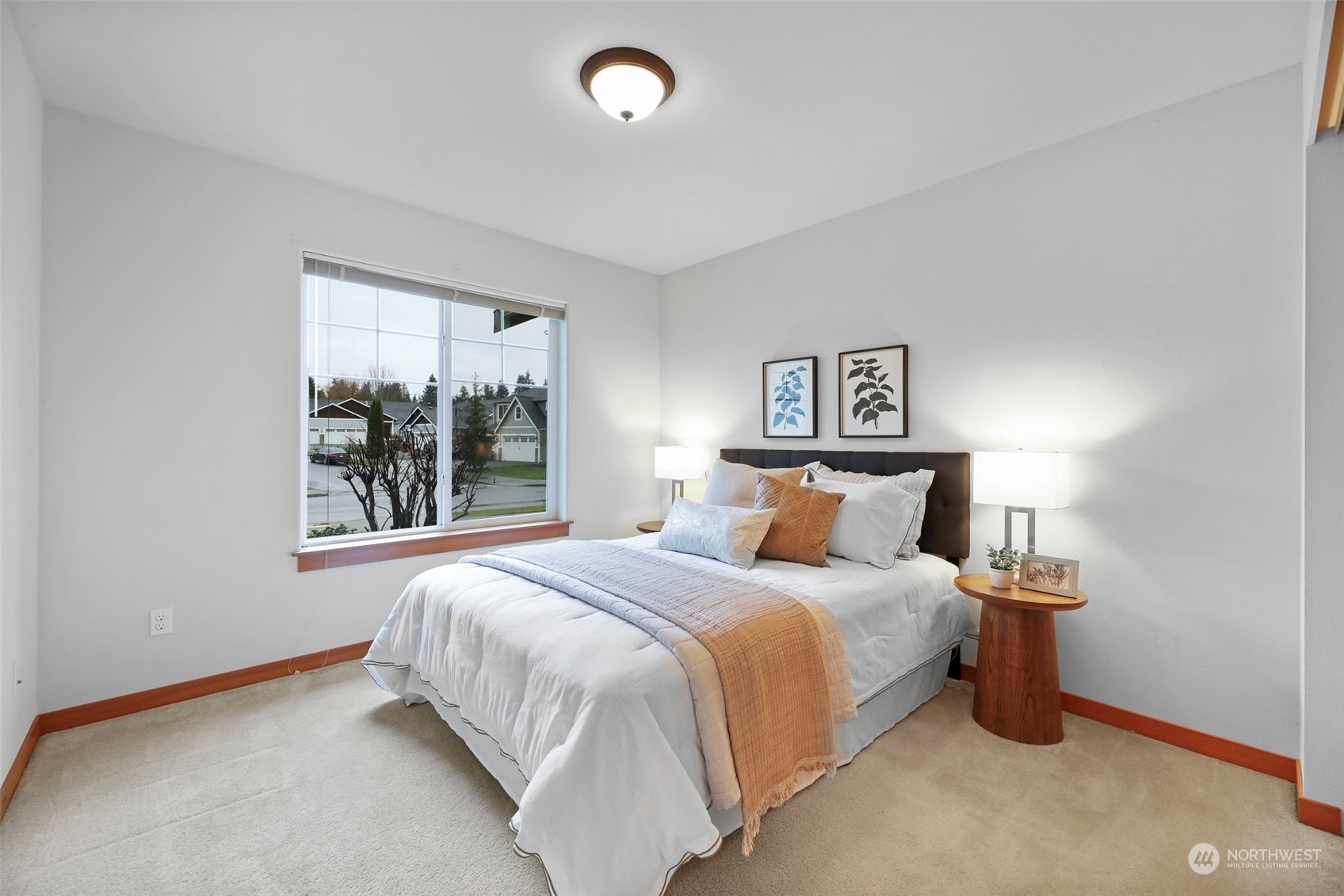 910 209th Street Southeast Bothell, WA 98021 - Photo 20 of 28 a bedroom with a bed and a window