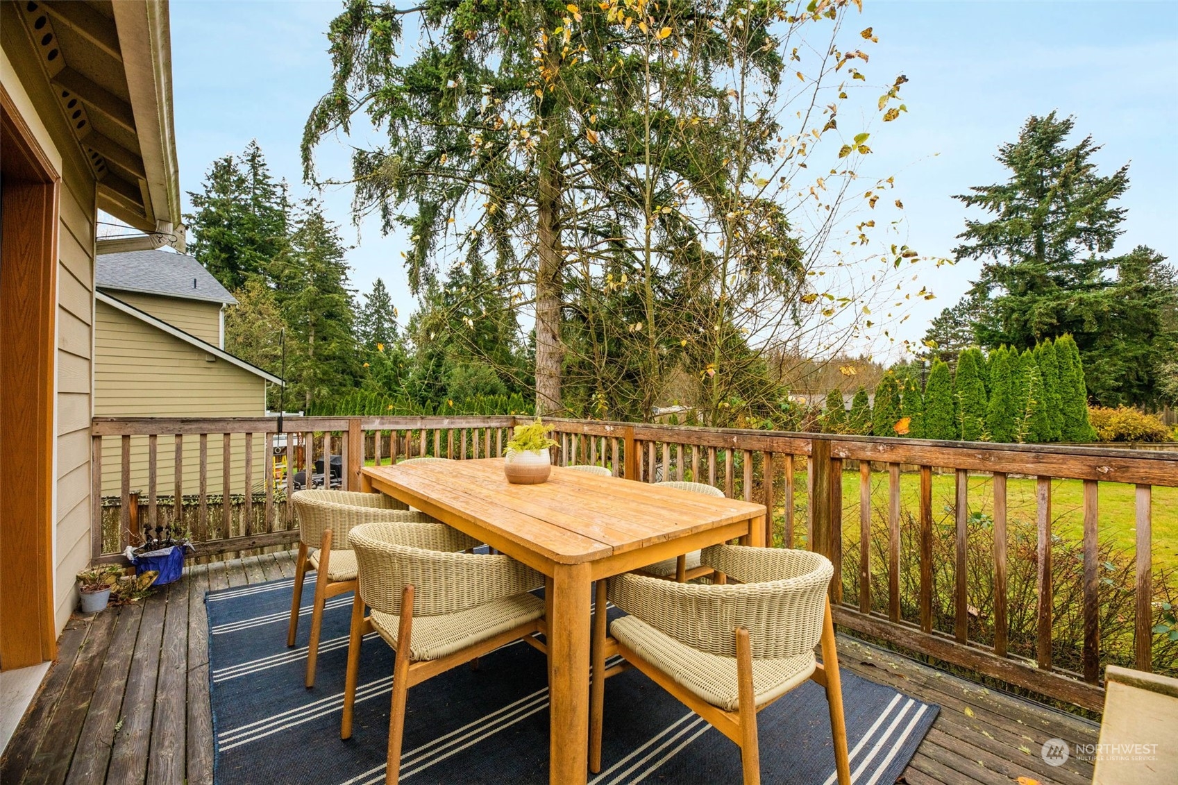 910 209th Street Southeast Bothell, WA 98021 - Photo 24 of 28 a view of a balcony with table and chairs