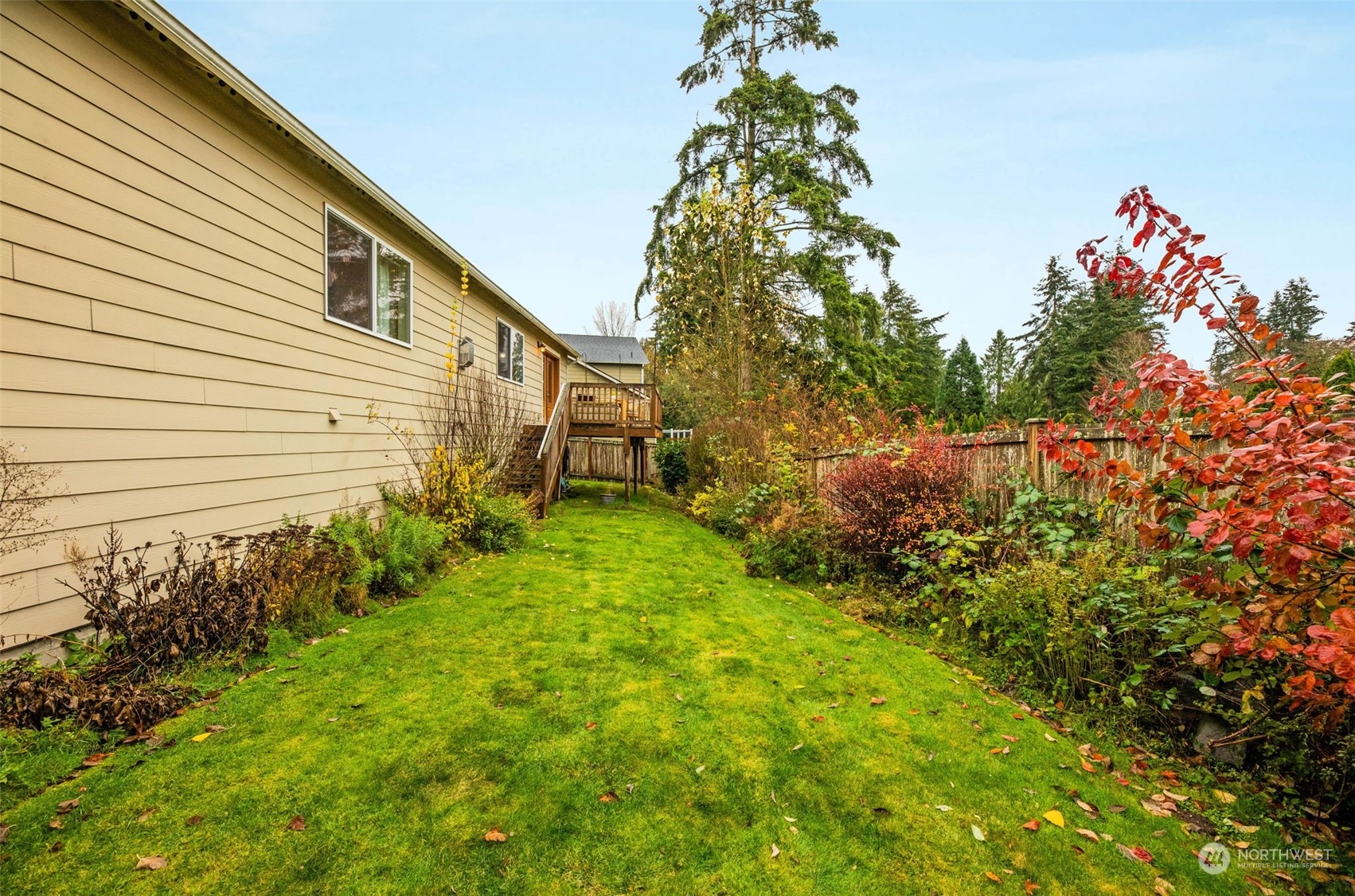 910 209th Street Southeast Bothell, WA 98021 - Photo 26 of 28 a backyard of a house with lots of green space