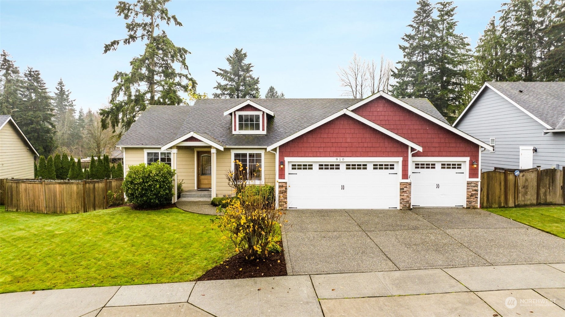 910 209th Street Southeast Bothell, WA 98021 - Photo 3 of 28 a view of a yard in front of a house with plants and large tree