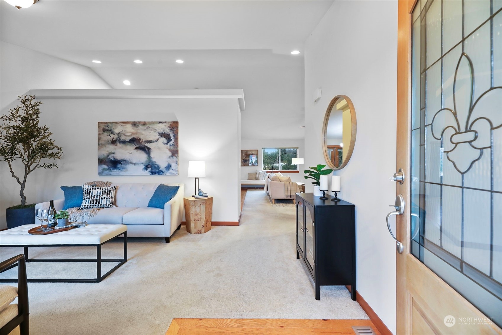 910 209th Street Southeast Bothell, WA 98021 - Photo 6 of 28 a living room with furniture and a painting on the wall