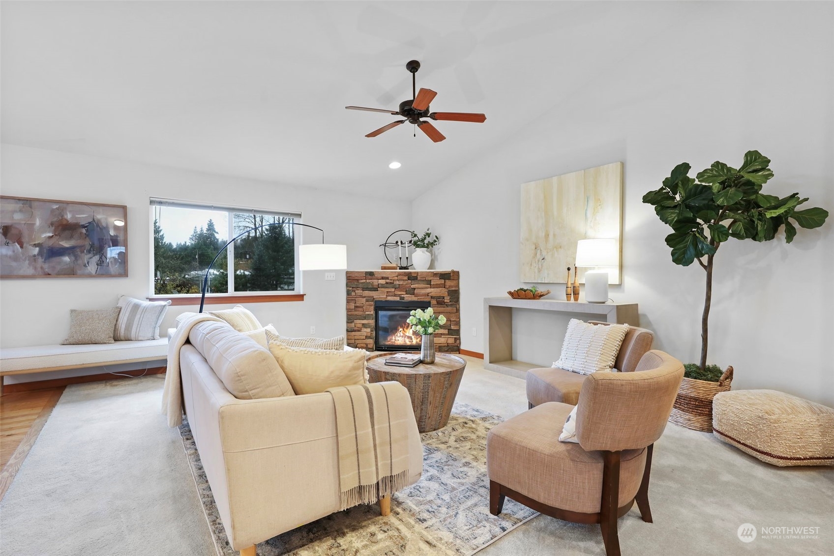 910 209th Street Southeast Bothell, WA 98021 - Photo 8 of 28 a living room with furniture a chandelier and a large window