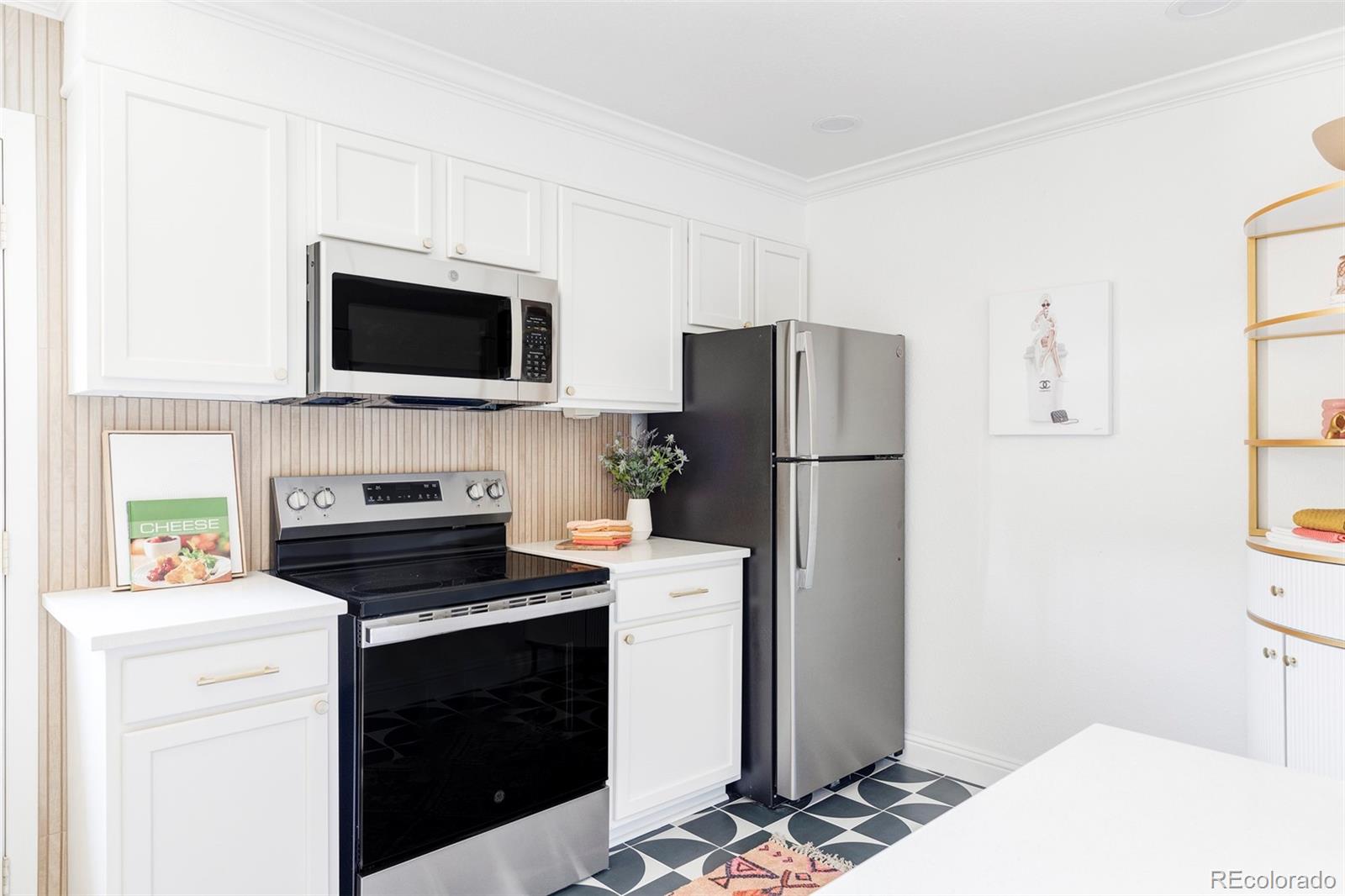 2313 South Race Street, Unit A Denver, CO 80210 - Photo 4 of 16 a kitchen with a refrigerator stove and microwave