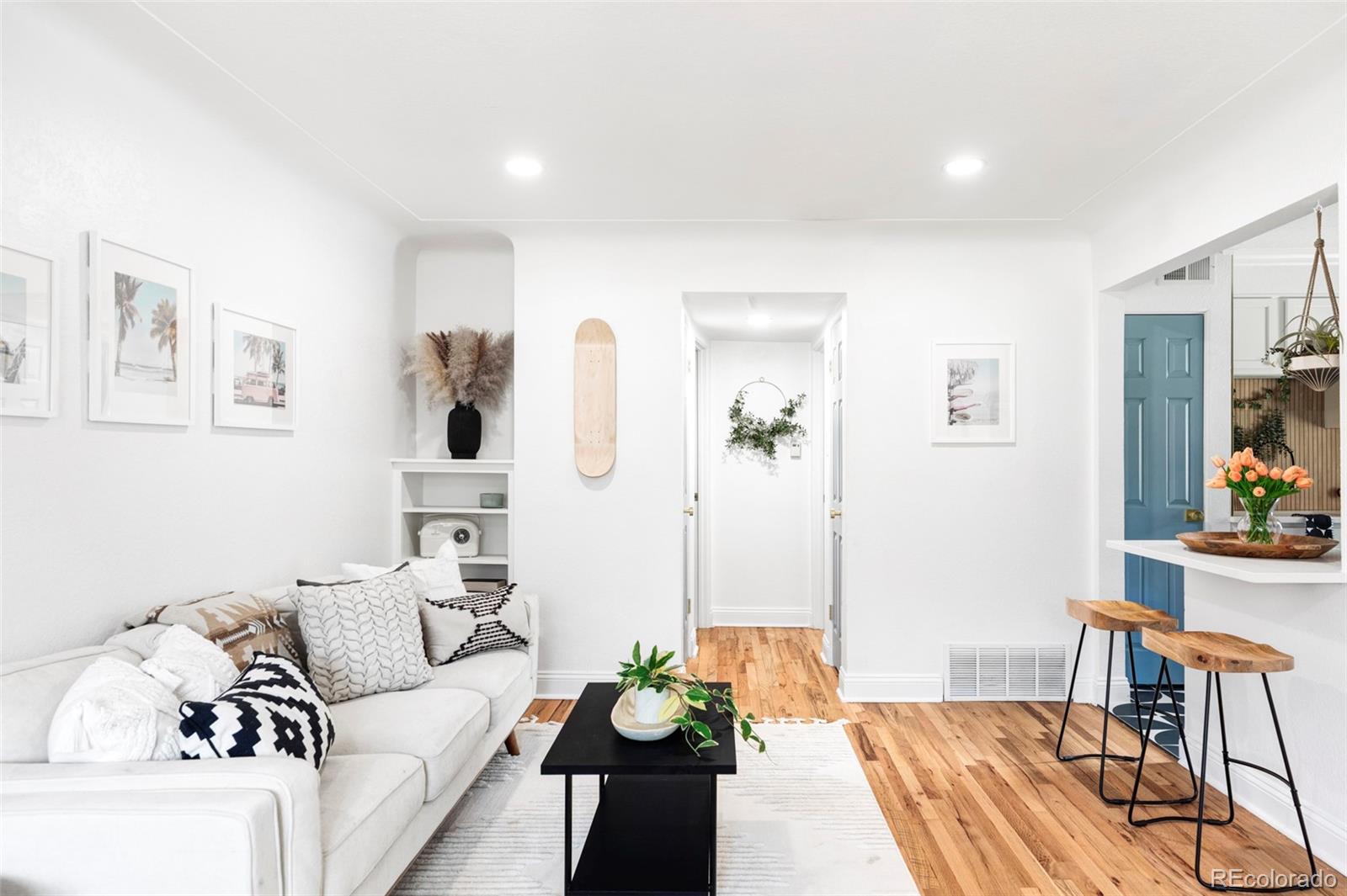 2313 South Race Street, Unit A Denver, CO 80210 - Photo 7 of 16 a living room with furniture and wooden floor