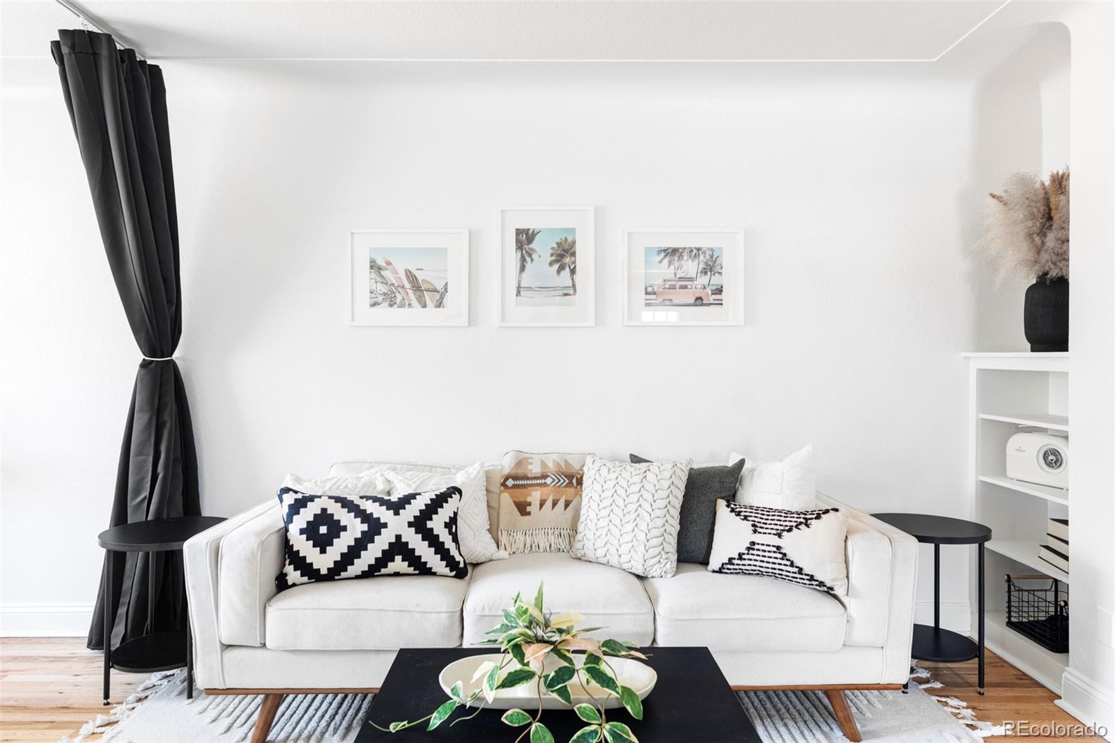 2313 South Race Street, Unit A Denver, CO 80210 - Photo 8 of 16 a living room with furniture and a flat screen tv