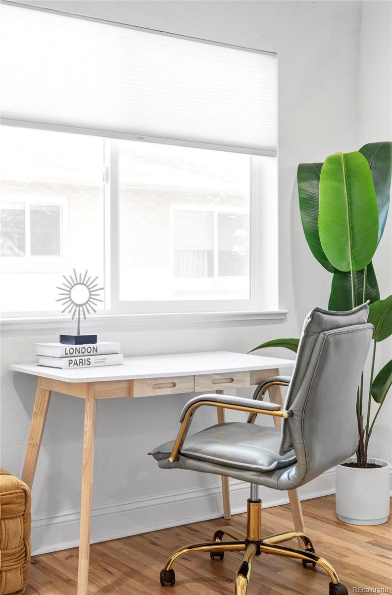 2313 South Race Street, Unit A Denver, CO 80210 - Photo 10 of 16 a room with a table chairs and a window