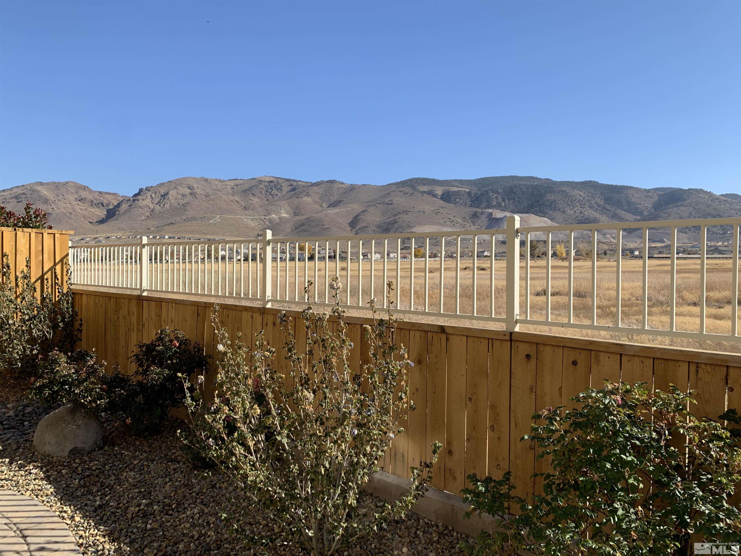 1970 Dark Horse Road, Unit C Reno, NV 89521 - Photo 1 of 35 a view of a house with a lake view
