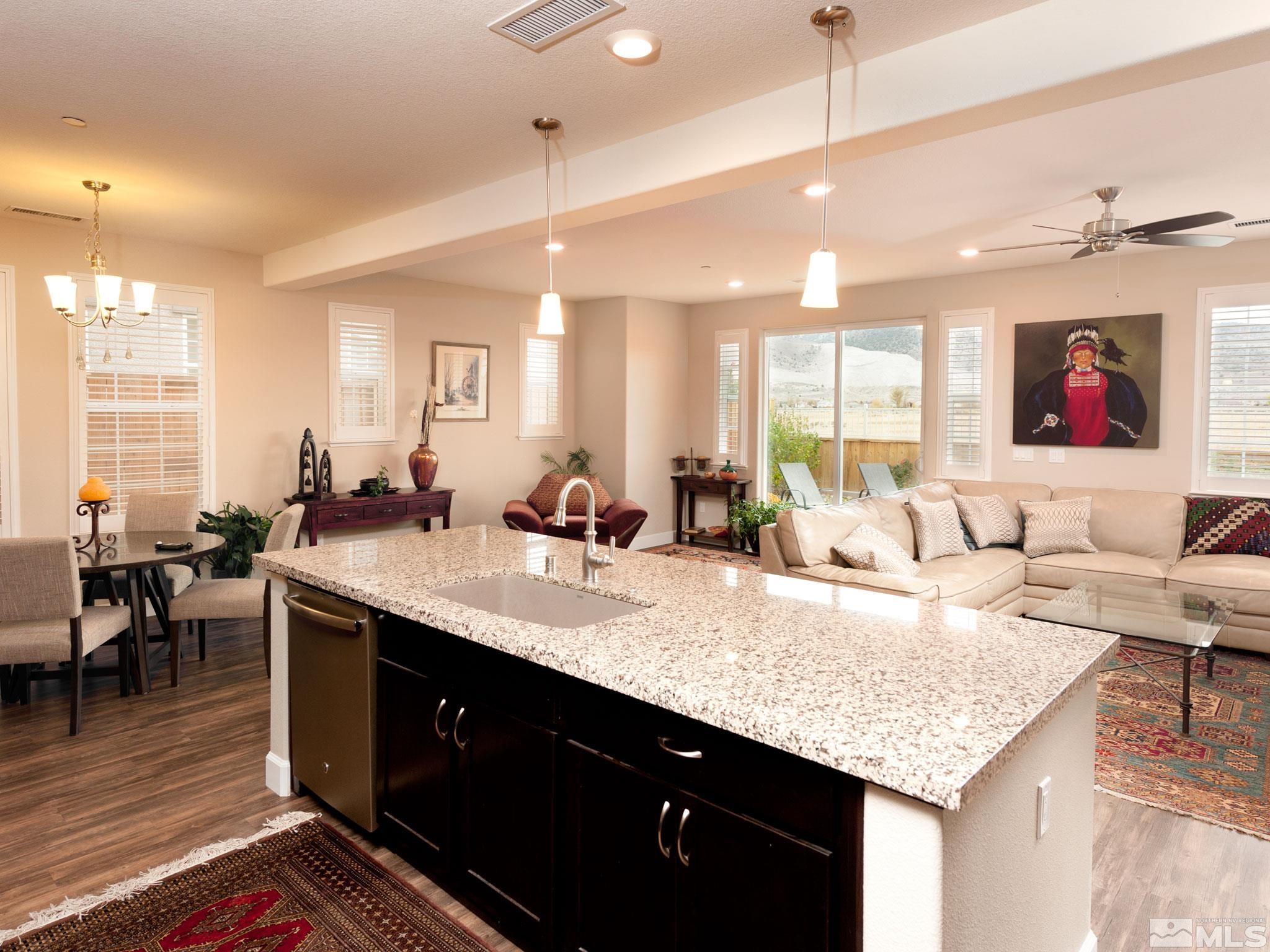1970 Dark Horse Road, Unit C Reno, NV 89521 - Photo 11 of 35 a living room with granite countertop kitchen island furniture and a chandelier