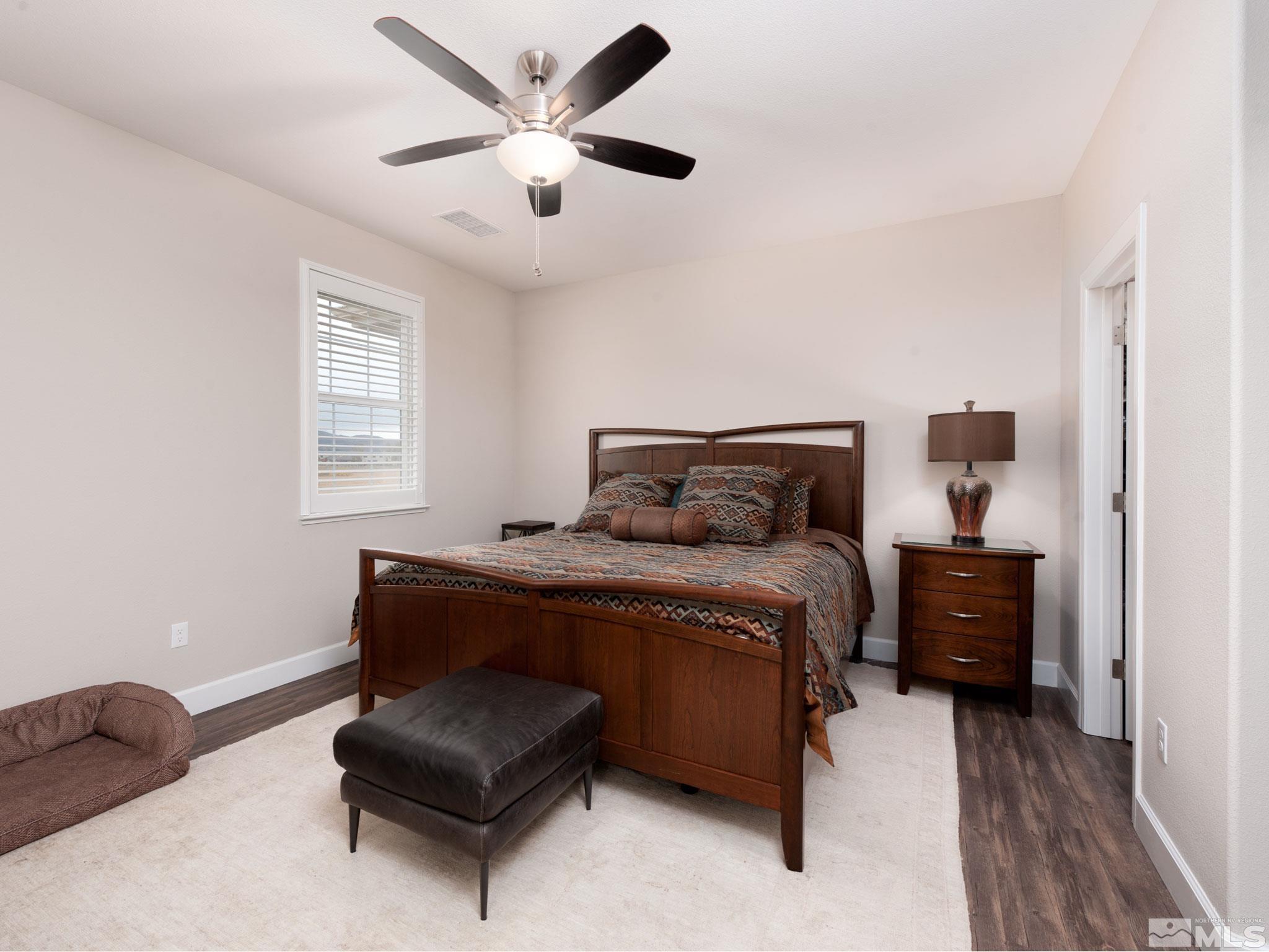 1970 Dark Horse Road, Unit C Reno, NV 89521 - Photo 18 of 35 a bedroom with a bed and a couch