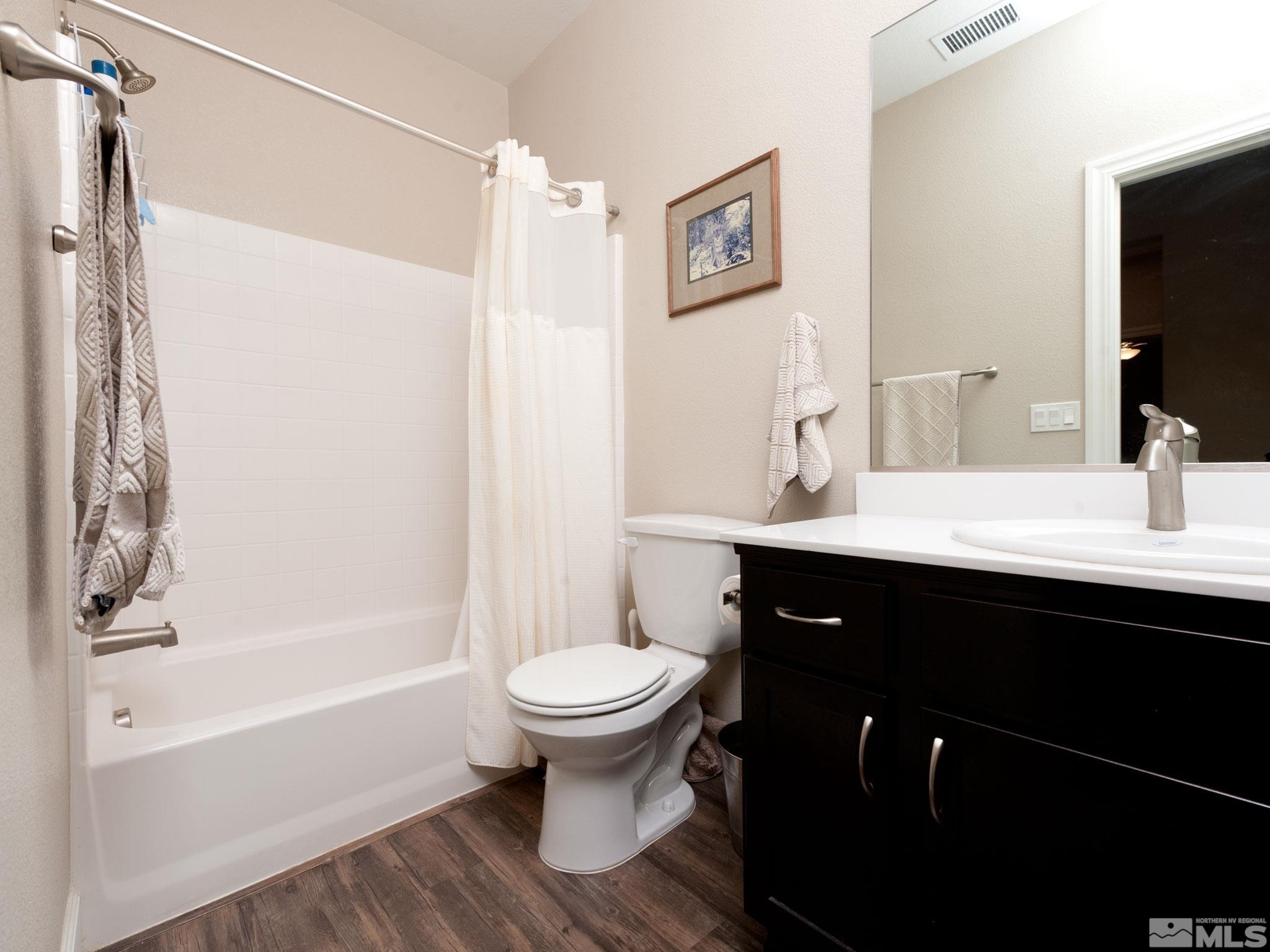 1970 Dark Horse Road, Unit C Reno, NV 89521 - Photo 23 of 35 a bathroom with a sink and a mirror