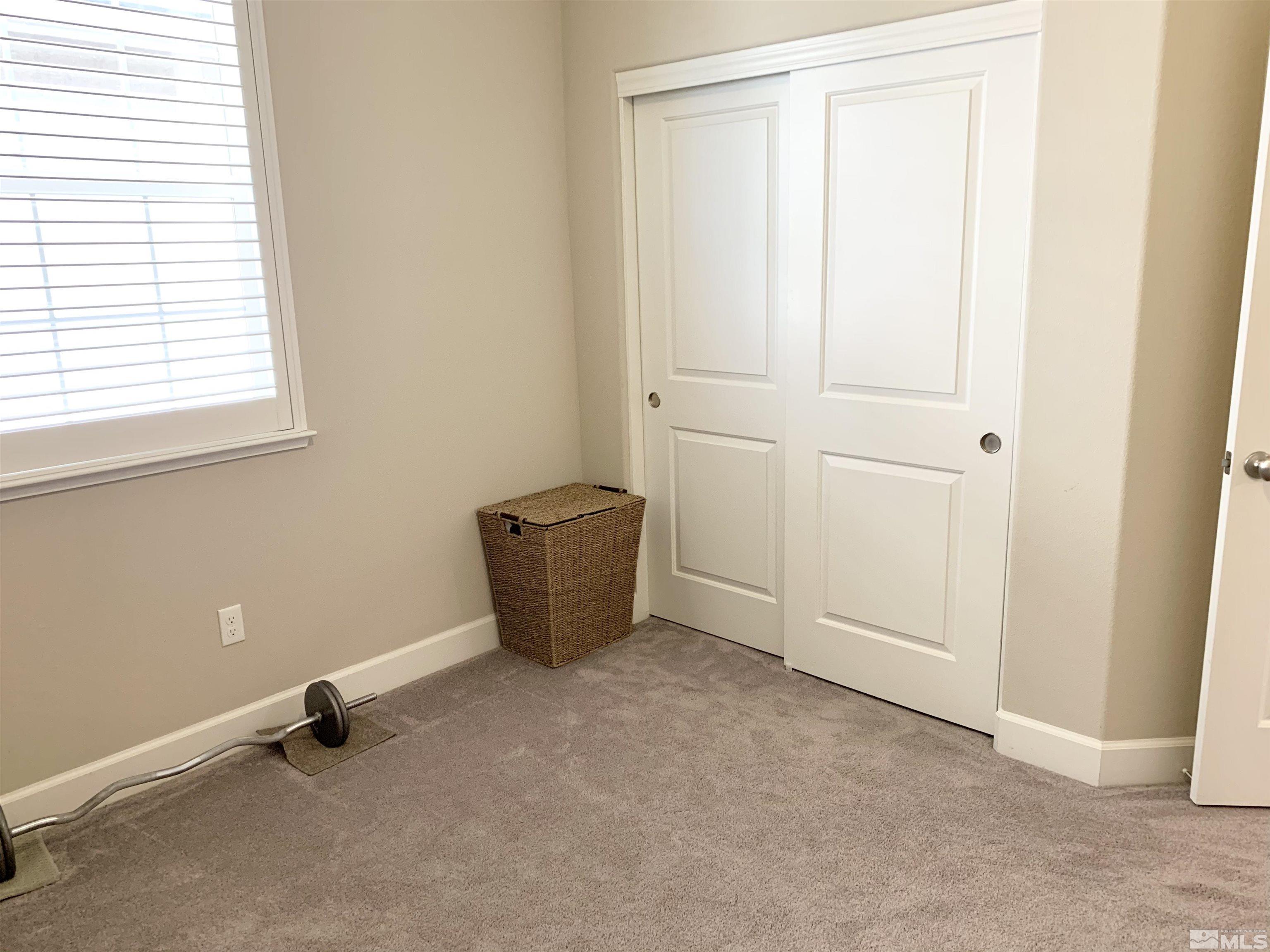 1970 Dark Horse Road, Unit C Reno, NV 89521 - Photo 25 of 35 an empty room with windows