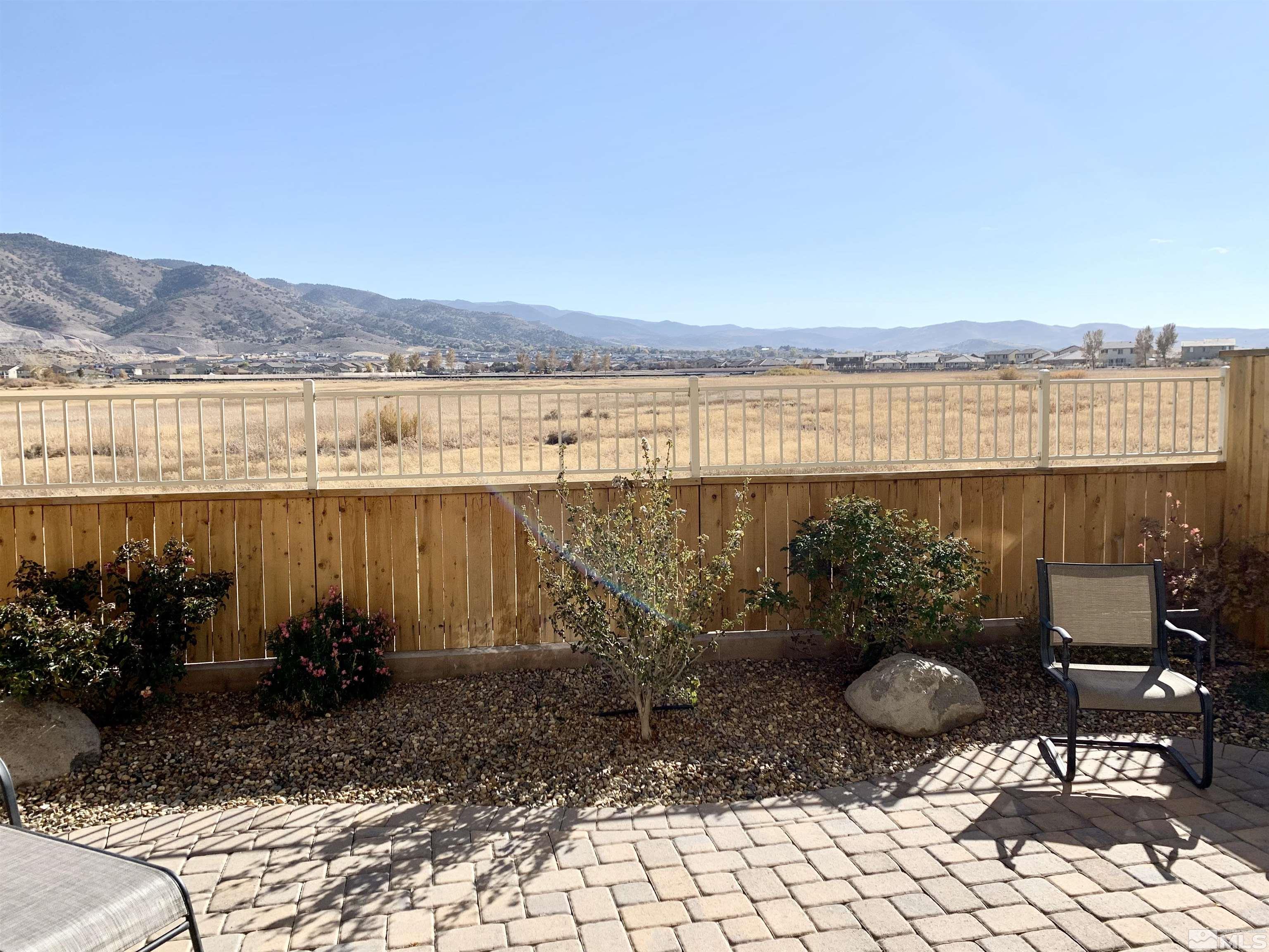 1970 Dark Horse Road, Unit C Reno, NV 89521 - Photo 3 of 35 a view of a terrace with chairs and potted plants