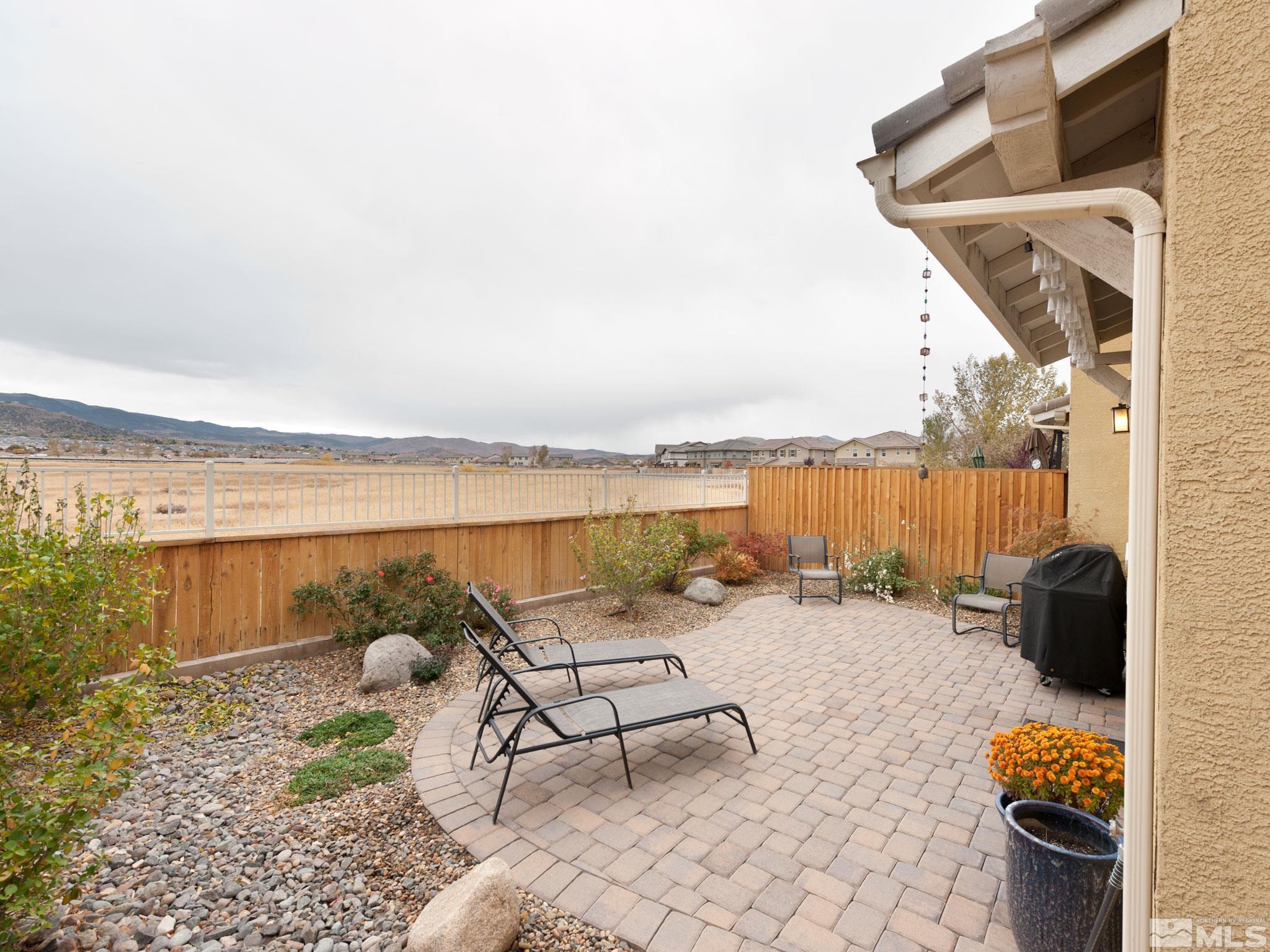 1970 Dark Horse Road, Unit C Reno, NV 89521 - Photo 33 of 35 a terrace with outdoor seating and city view