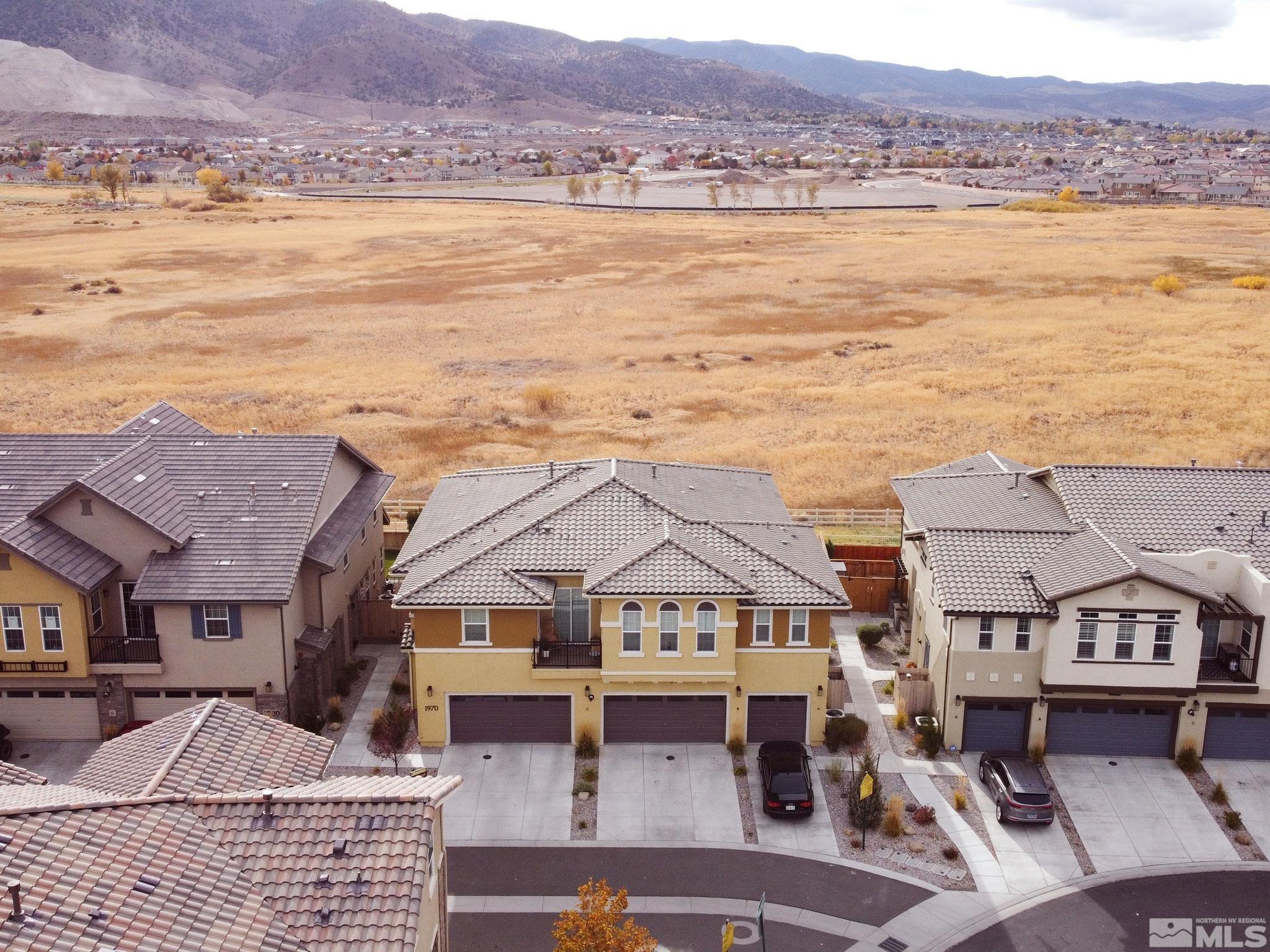 1970 Dark Horse Road, Unit C Reno, NV 89521 - Photo 34 of 35 an aerial view of residential houses with outdoor space and ocean view