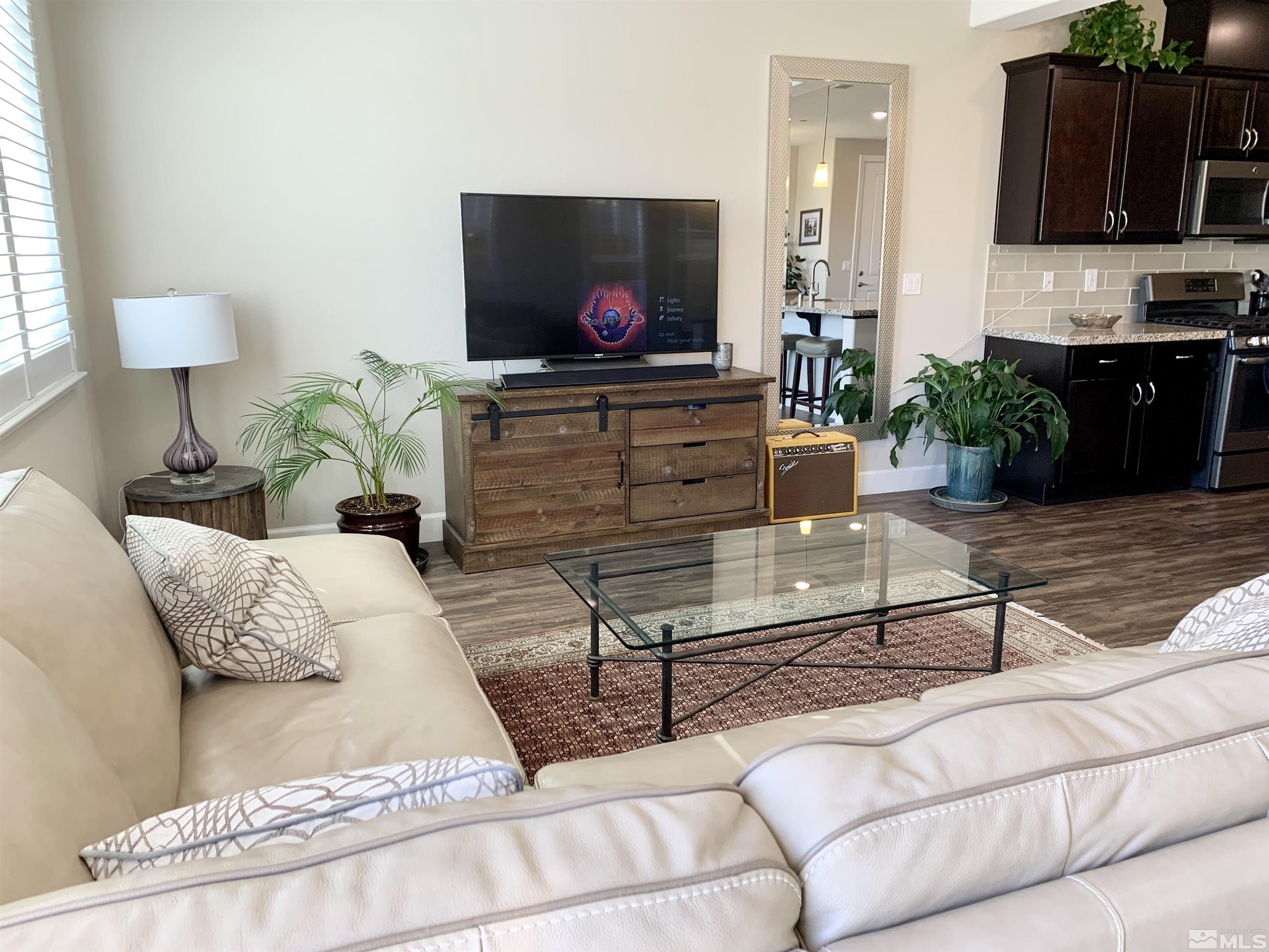 1970 Dark Horse Road, Unit C Reno, NV 89521 - Photo 7 of 35 a living room with furniture and a flat screen tv