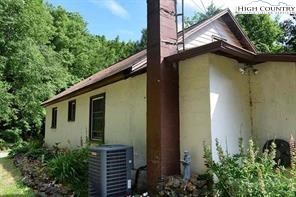1495 Cobbs Creek Road Boone, NC 28607 - Photo 12 of 22 a view of a house with a yard