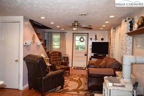 1495 Cobbs Creek Road Boone, NC 28607 - Photo 13 of 22 a living room with furniture and a flat screen tv