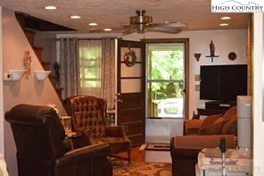 1495 Cobbs Creek Road Boone, NC 28607 - Photo 14 of 22 a living room with furniture and a flat screen tv