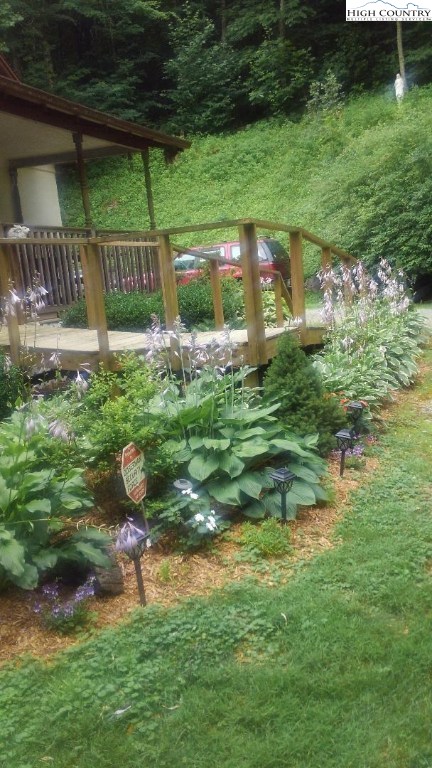1495 Cobbs Creek Road Boone, NC 28607 - Photo 20 of 22 a view of a backyard of a house with a yard