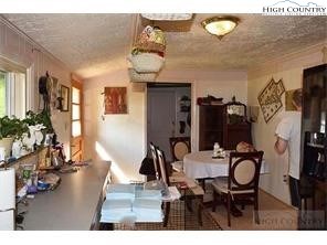 1495 Cobbs Creek Road Boone, NC 28607 - Photo 2 of 22 a living room with furniture and wooden floor