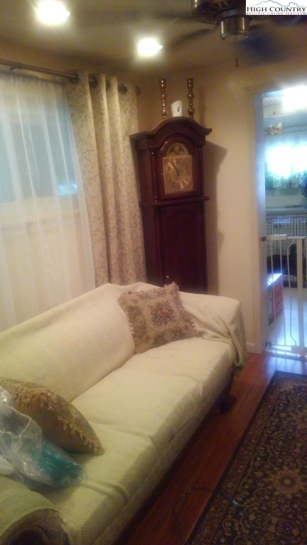 1495 Cobbs Creek Road Boone, NC 28607 - Photo 3 of 22 a bedroom with a bed and a mirror