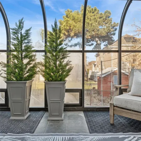 a view of a porch with a tree
