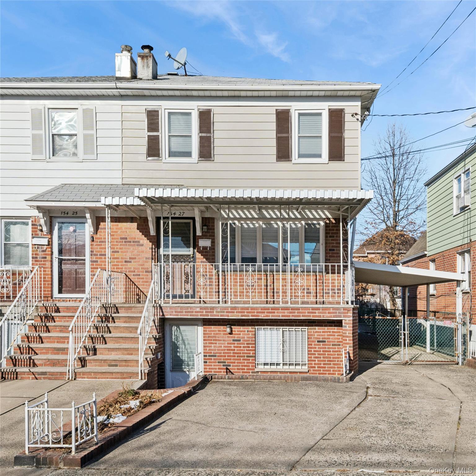 154-27 20th Road Queens, NY 11357 - Photo 2 of 30 a front view of a house with a balcony