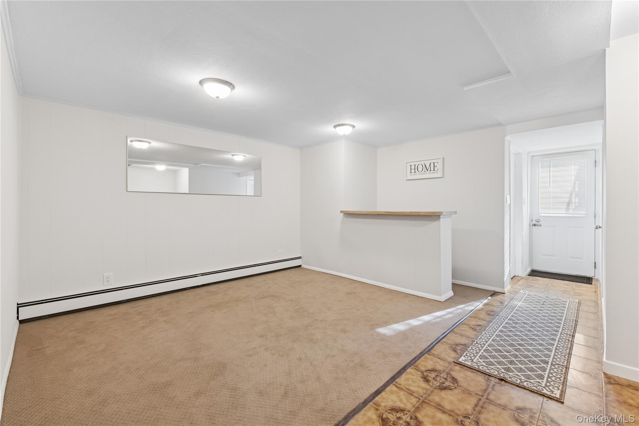 154-27 20th Road Queens, NY 11357 - Photo 24 of 30 wooden floor in an empty room with a window