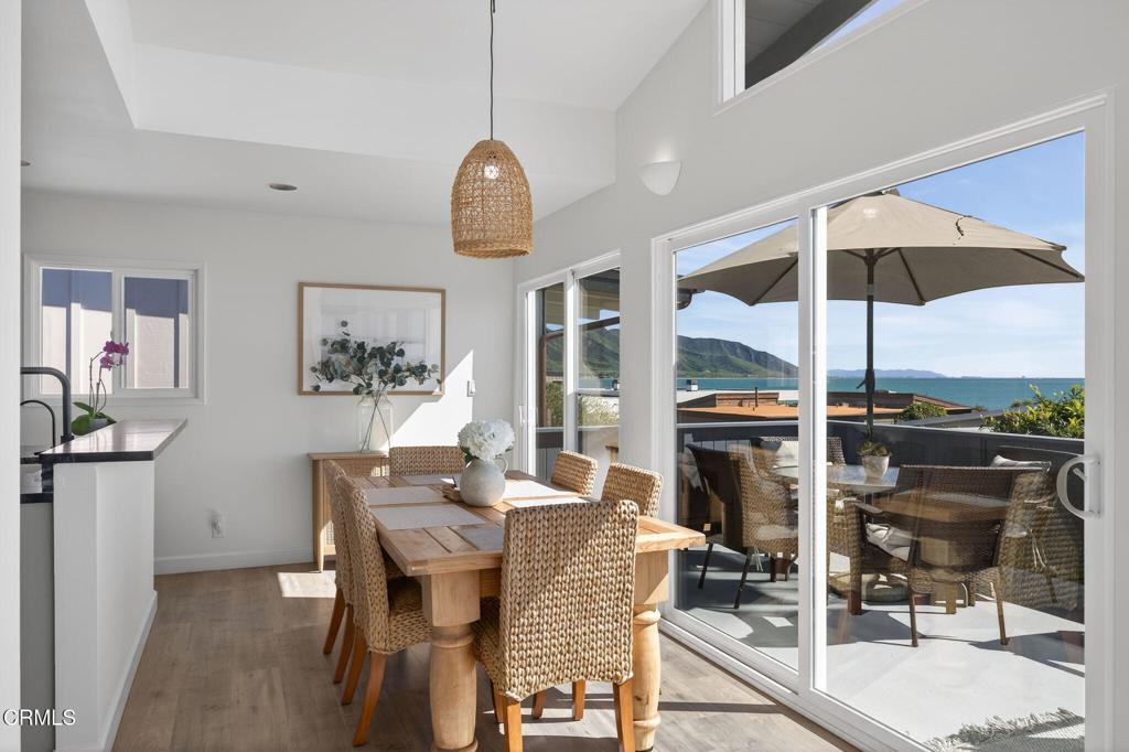 4229 Faria Road Ventura, CA 93001 - Photo 14 of 47 a view of a dining room with furniture window and wooden floor