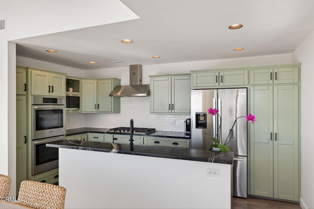 4229 Faria Road Ventura, CA 93001 - Photo 16 of 47 a kitchen with granite countertop a sink stainless steel appliances and cabinets