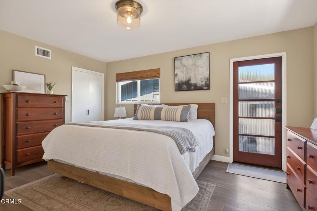 4229 Faria Road Ventura, CA 93001 - Photo 22 of 47 a spacious bedroom with a bed and a cabinets