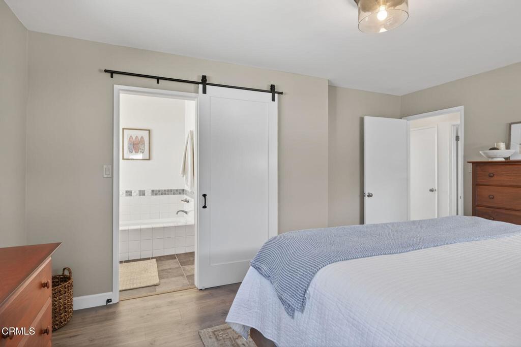 4229 Faria Road Ventura, CA 93001 - Photo 23 of 47 a bedroom with a bed and a cabinets