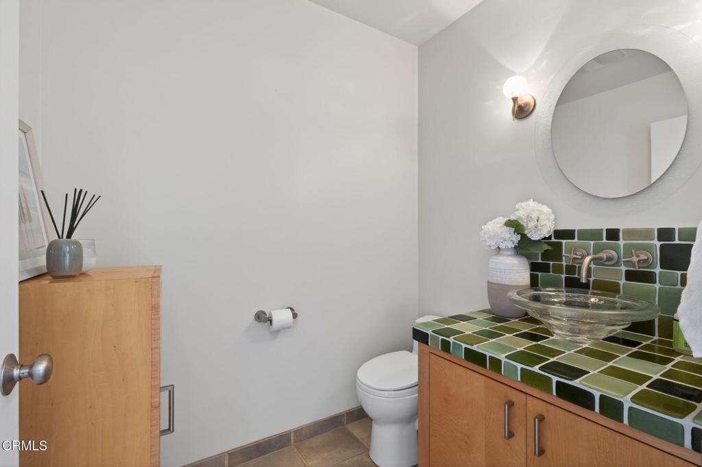 4229 Faria Road Ventura, CA 93001 - Photo 26 of 47 a bathroom with a sink and a mirror