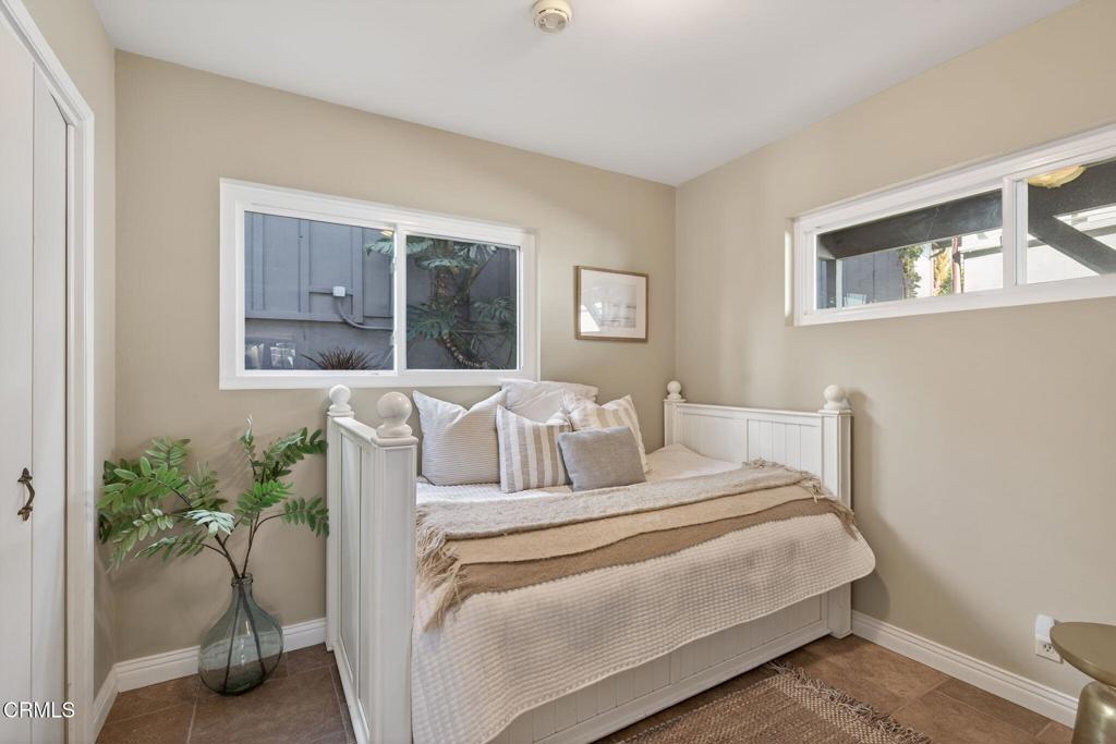4229 Faria Road Ventura, CA 93001 - Photo 27 of 47 a bedroom with a bed and a potted plant
