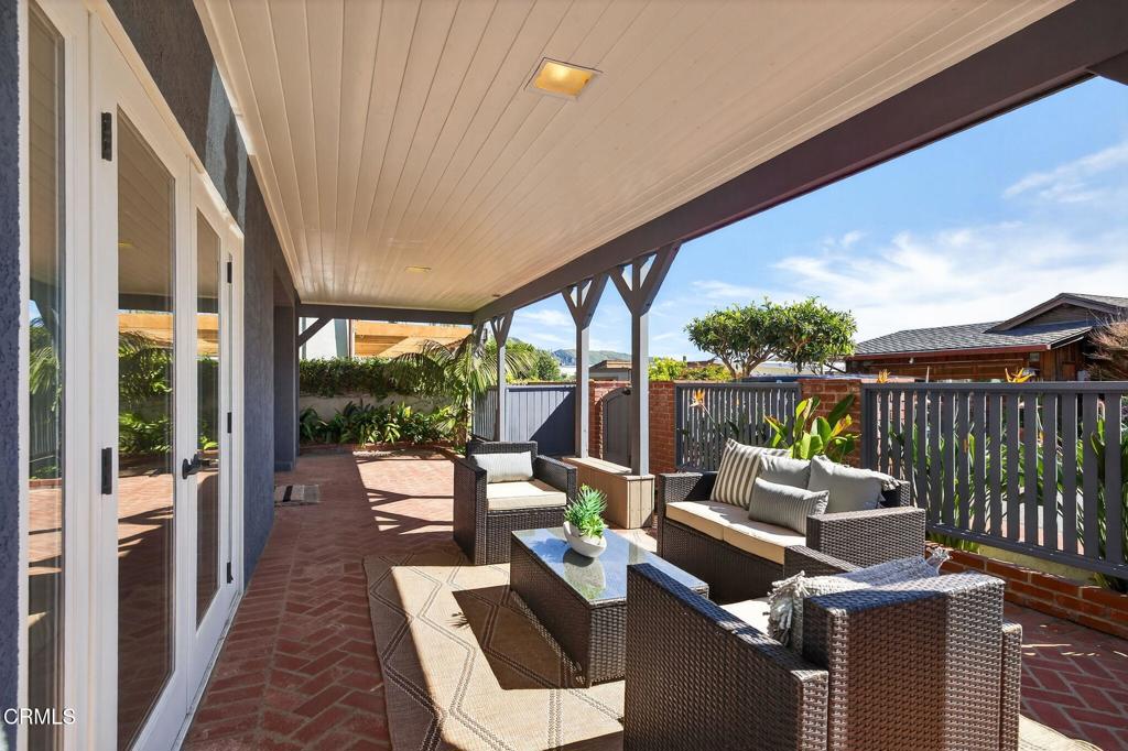 4229 Faria Road Ventura, CA 93001 - Photo 3 of 47 a balcony with wooden floor and outdoor seating