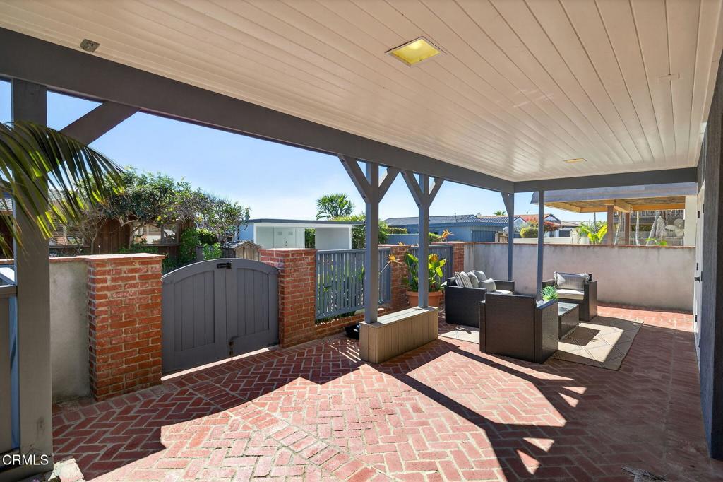 4229 Faria Road Ventura, CA 93001 - Photo 4 of 47 a bed room with a bed and glass door