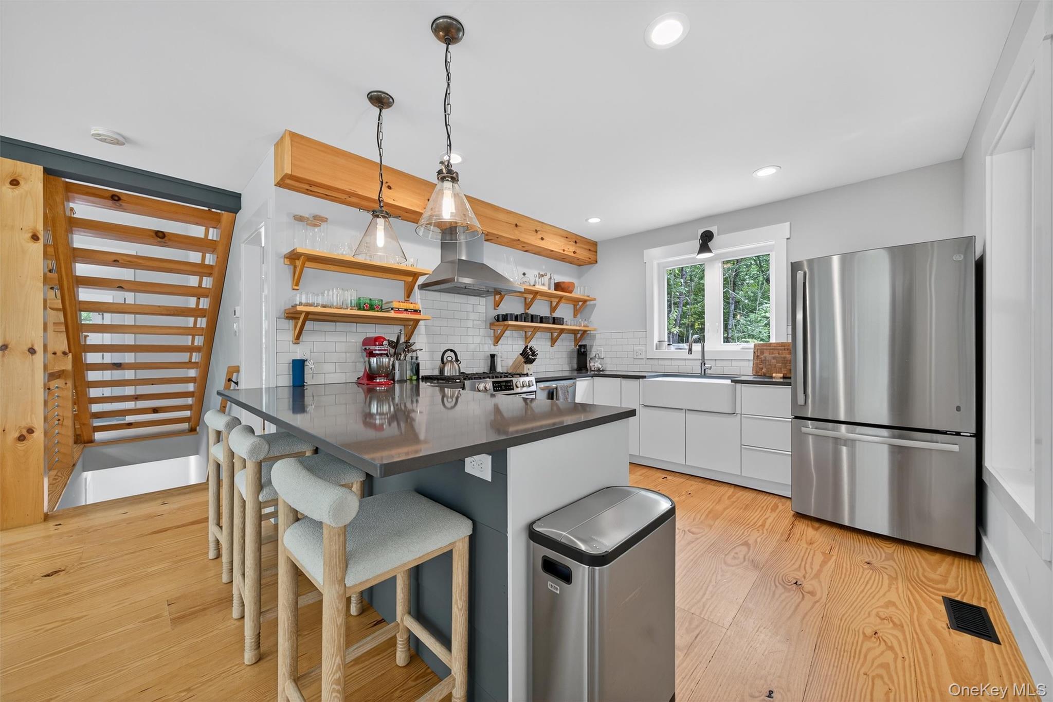 107 Maple Lane Narrowsburg, NY 12764 - Photo 15 of 49 a kitchen with stainless steel appliances granite countertop a sink a stove and a refrigerator