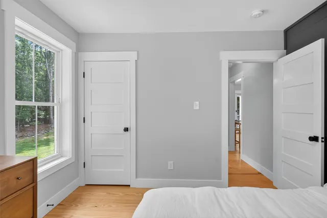 a view of room with window and hardwood floor