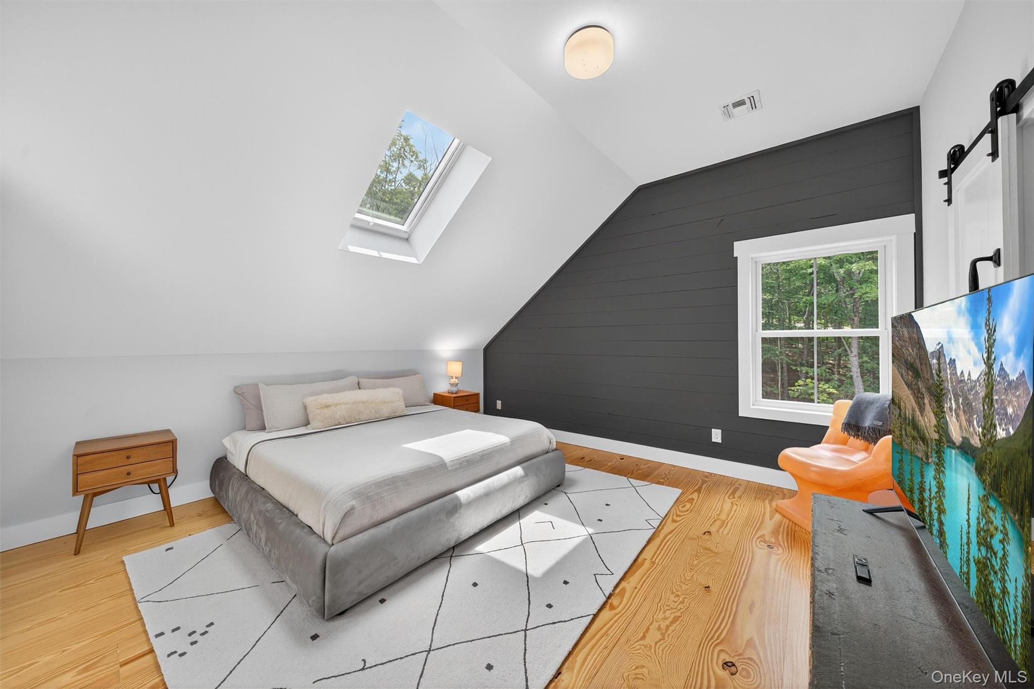 107 Maple Lane Narrowsburg, NY 12764 - Photo 24 of 49 a living room with furniture and a window